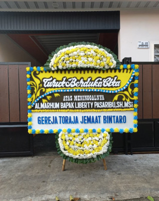 Papan Bunga Duka di Mengger